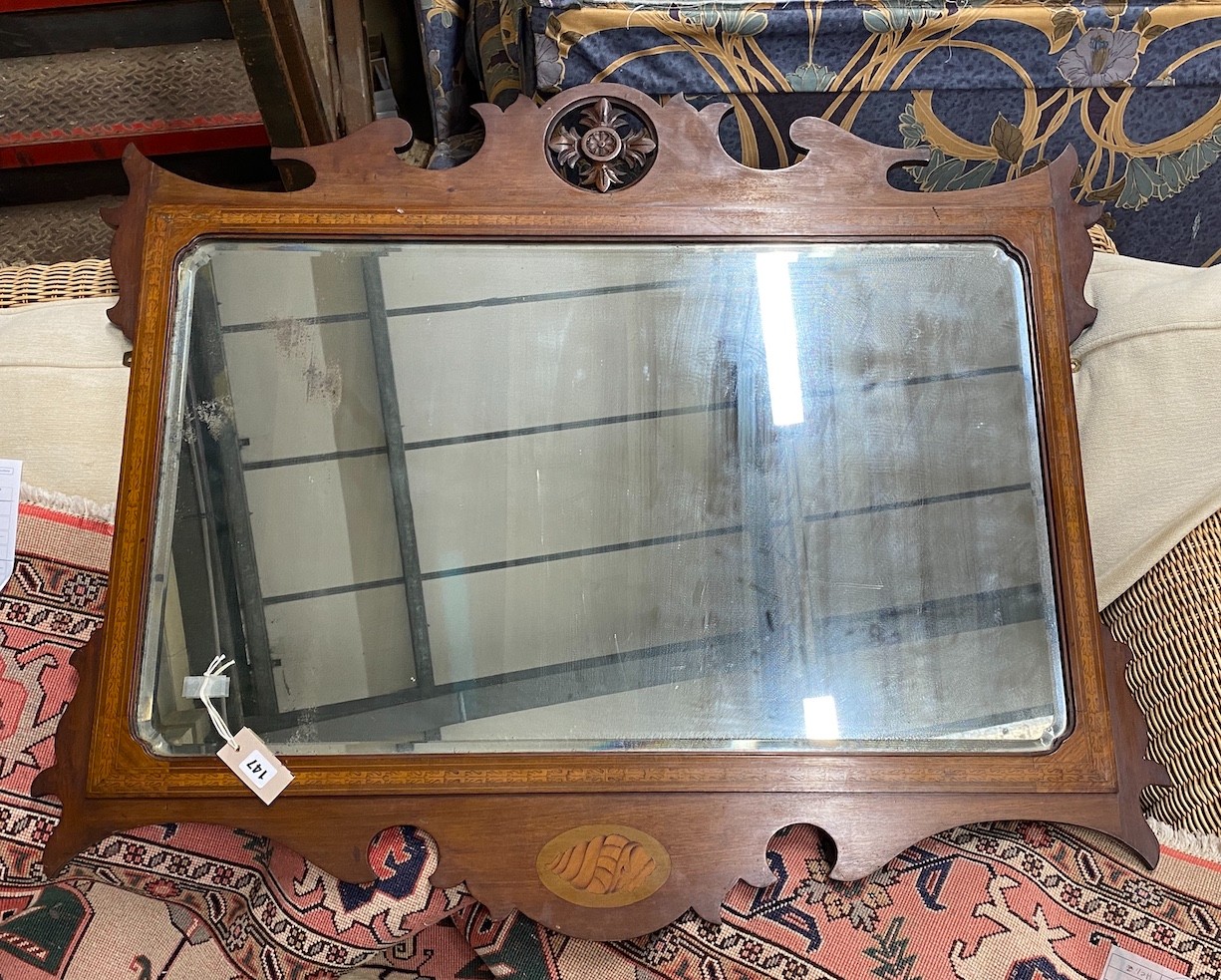 A George III style mahogany and marquetry fret cut landscape mirror